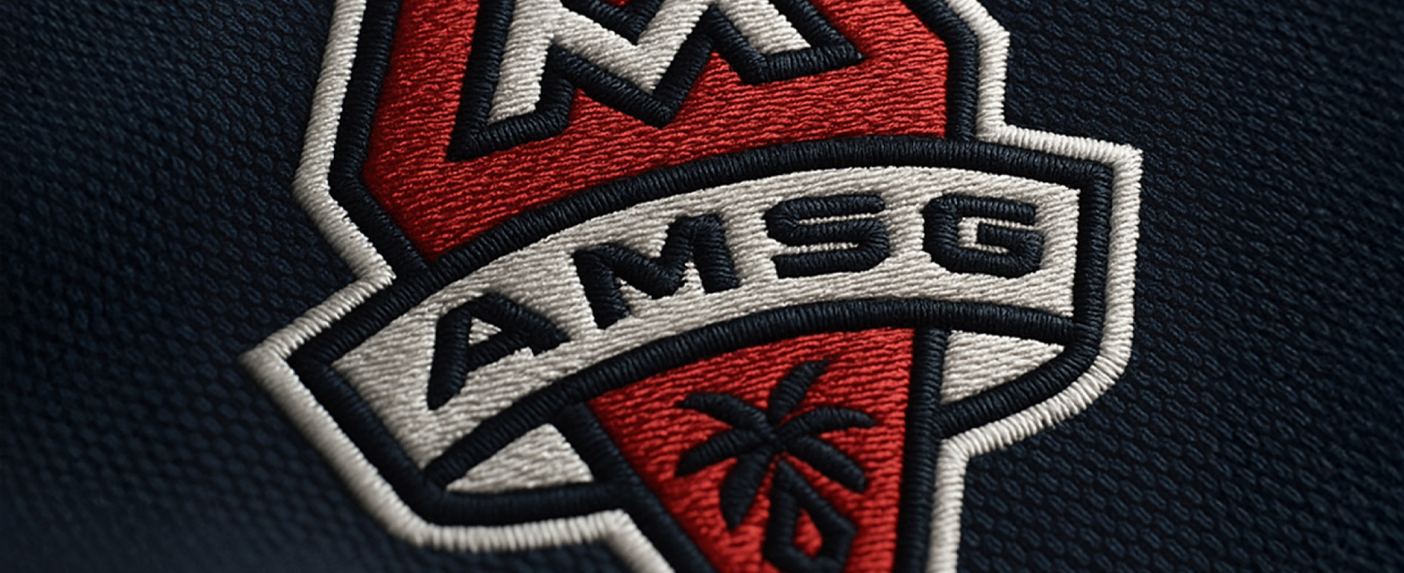 AMSG embroidered crest close-up
