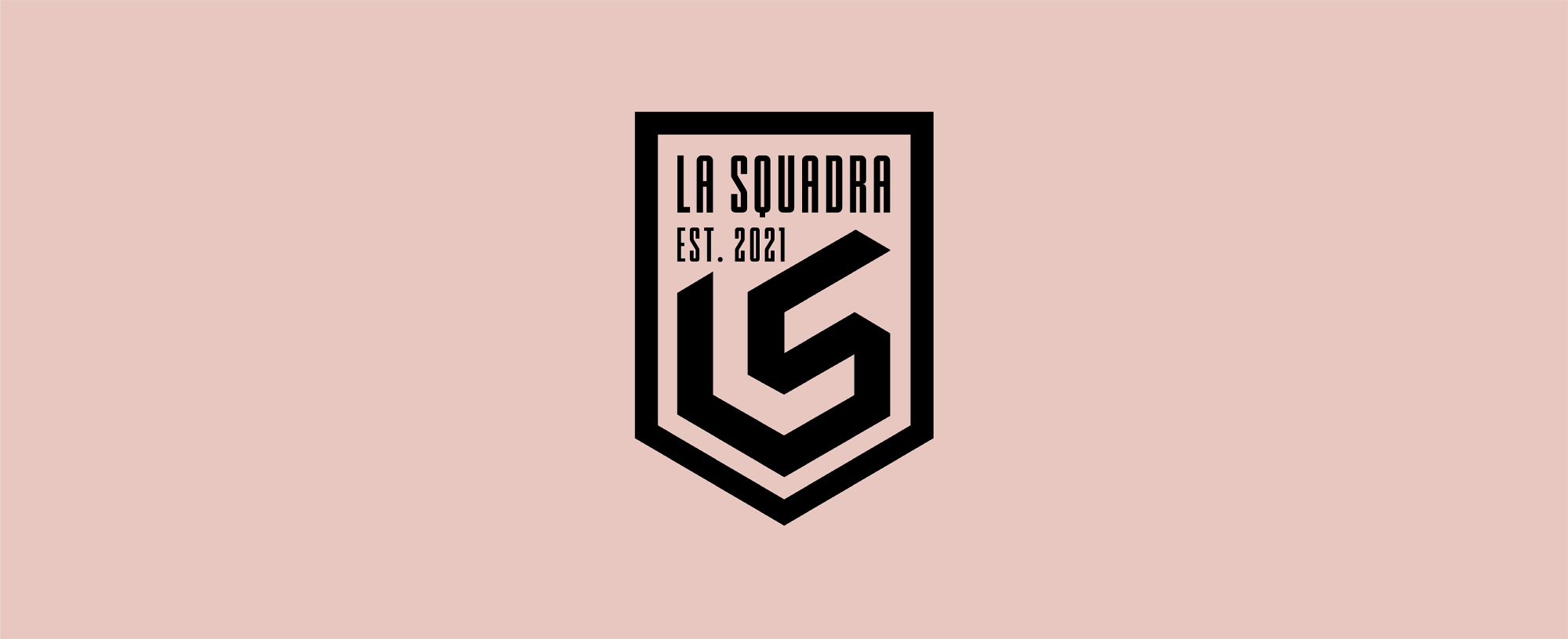La Squadra badge on blush background